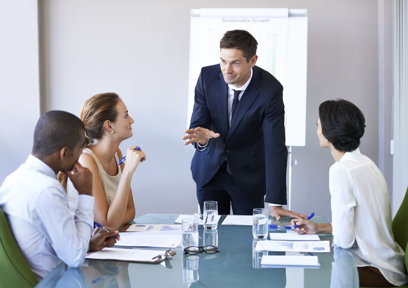 male employee leading meeting